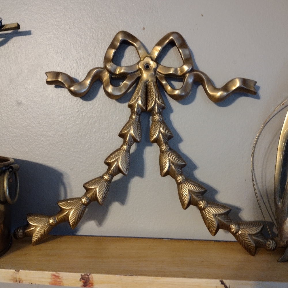 Vintage brass bow adornment